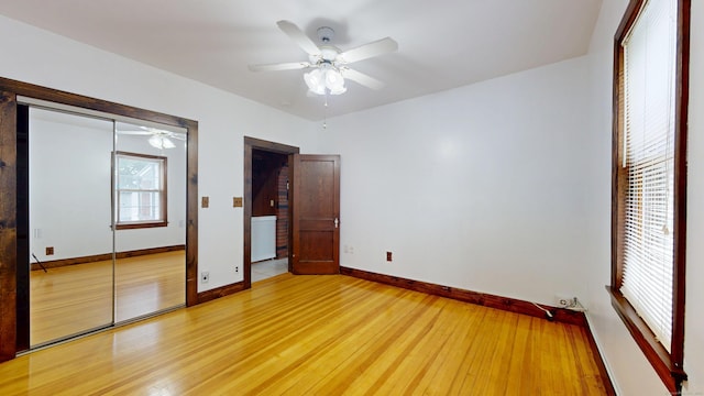 8 Kent St, Plainville, CT 06062 - unfurnished bedroom with light wood finished floors, baseboards, a ceiling fan, and a closet