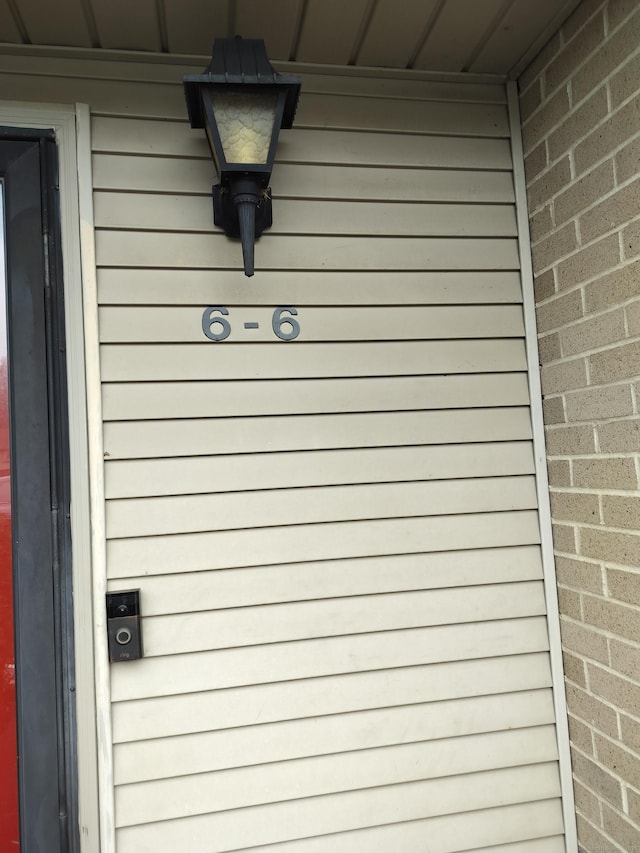 exterior details featuring brick siding