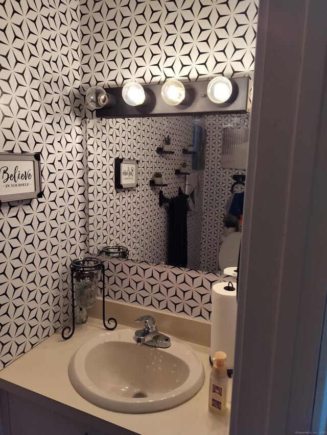 827 Oronoke Rd Apt 6-6, Waterbury, CT 06708 - bathroom with vanity and backsplash