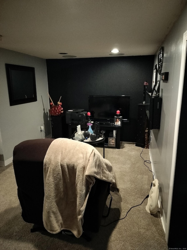 interior space with baseboards and carpet floors