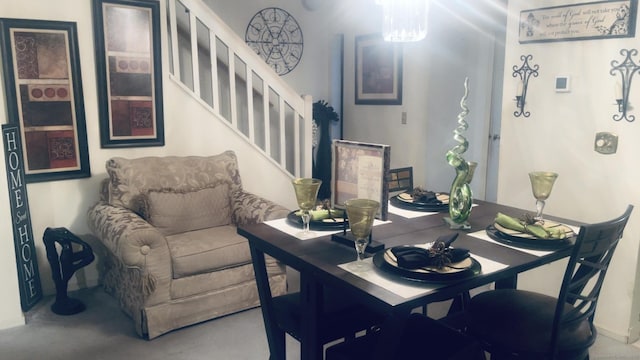 dining room featuring stairs
