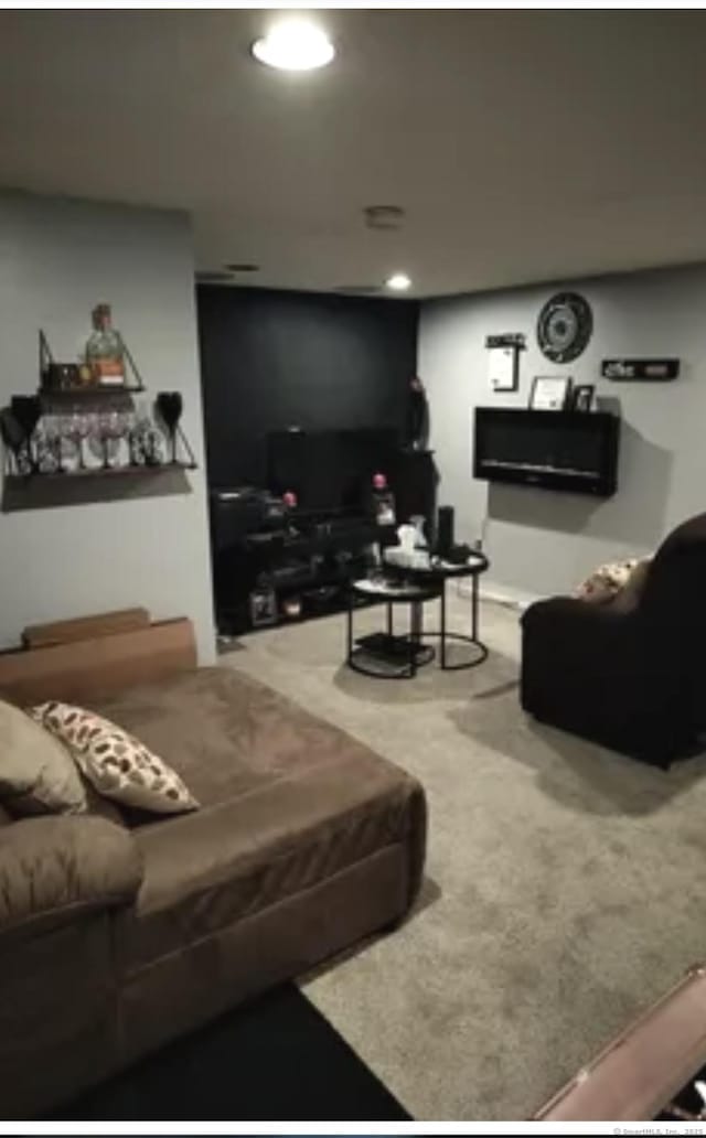 carpeted living area featuring recessed lighting