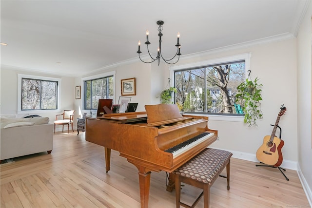 2 Donald Dr, Westport, CT 06880 - living area featuring light wood-style flooring, a chandelier, ornamental molding, and baseboards