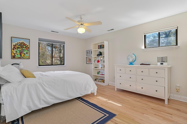 2 Donald Dr, Westport, CT 06880 - bedroom with light wood finished floors, baseboards, and a ceiling fan
