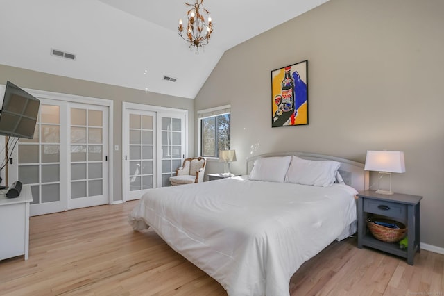 2 Donald Dr, Westport, CT 06880 - bedroom with french doors, vaulted ceiling, wood finished floors, a chandelier, and access to exterior