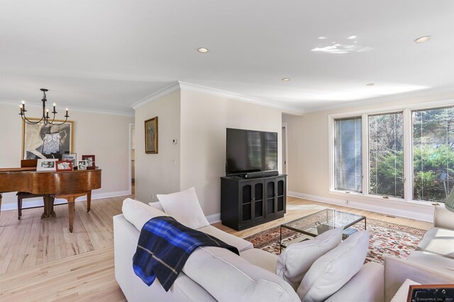 2 Donald Dr, Westport, CT 06880 - living area featuring a chandelier, light wood-type flooring, crown molding, baseboards, and recessed lighting