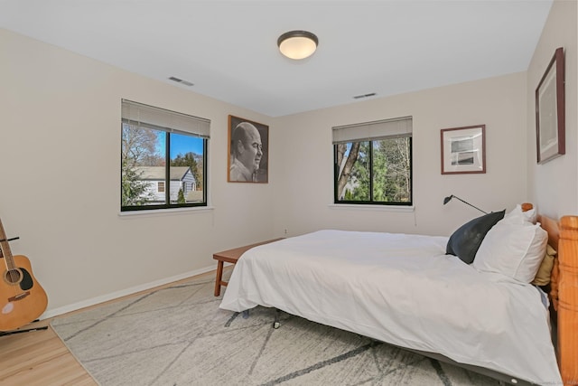 2 Donald Dr, Westport, CT 06880 - bedroom featuring multiple windows, baseboards, and wood finished floors