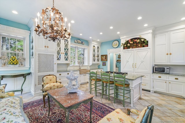 5 Northside Ln, Westport, CT 06880 - living room with plenty of natural light, light tile patterned floors, recessed lighting, a chandelier, and ornamental molding