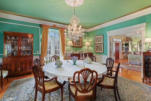 5 Northside Ln, Westport, CT 06880 - dining space featuring crown molding, a chandelier, a wainscoted wall, and wood finished floors