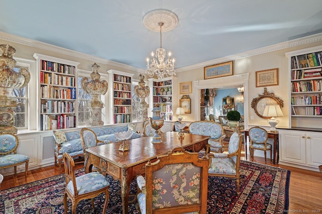 5 Northside Ln, Westport, CT 06880 - dining space with a chandelier, light wood finished floors, ornamental molding, and built in shelves