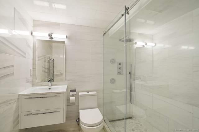 5 Northside Ln, Westport, CT 06880 - bathroom with tile walls, vanity, a stall shower, and a towel warmer