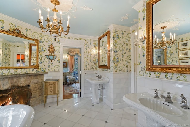 5 Northside Ln, Westport, CT 06880 - full bath with a chandelier, wallpapered walls, wainscoting, crown molding, and a stone fireplace