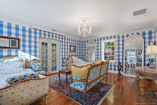 5 Northside Ln, Westport, CT 06880 - bedroom with wallpapered walls, ornamental molding, french doors, a chandelier, and hardwood / wood-style flooring