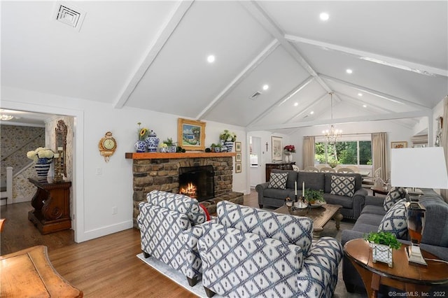 41 Hermit Ln, Westport, CT 06880 - living area featuring visible vents, an inviting chandelier, wood finished floors, a stone fireplace, and vaulted ceiling with beams