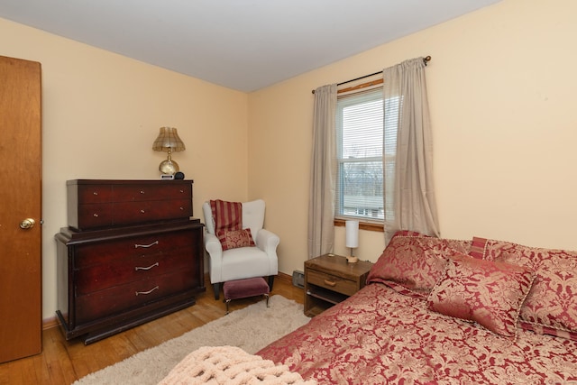 bedroom with wood finished floors