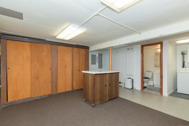 finished below grade area with electric panel and washer / dryer
