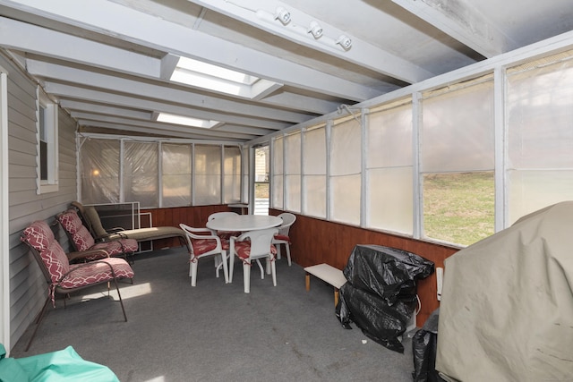 sunroom with outdoor dining area