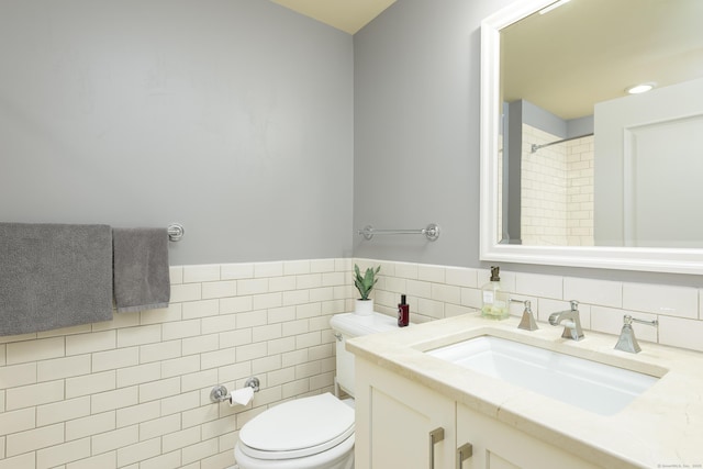 85 Memorial Rd Apt 414, West Hartford, CT 06107 - bathroom with toilet, vanity, a shower, and tile walls