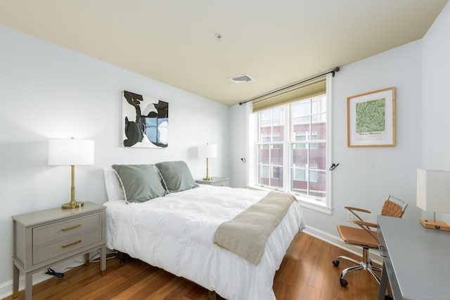 85 Memorial Rd Apt 414, West Hartford, CT 06107 - bedroom with wood finished floors, visible vents, and baseboards