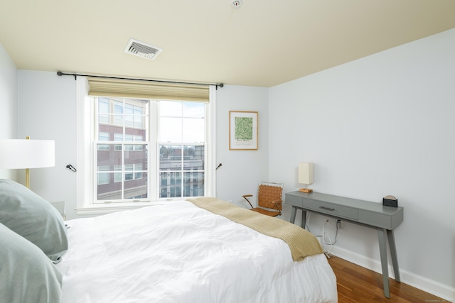 85 Memorial Rd Apt 414, West Hartford, CT 06107 - bedroom with baseboards, wood finished floors, and visible vents