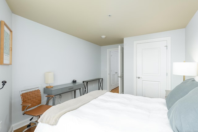 85 Memorial Rd Apt 414, West Hartford, CT 06107 - bedroom featuring baseboards and wood finished floors
