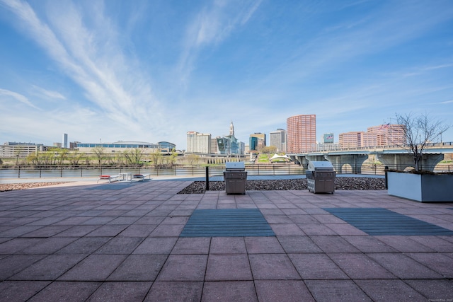 view of patio / terrace featuring grilling area and a city view