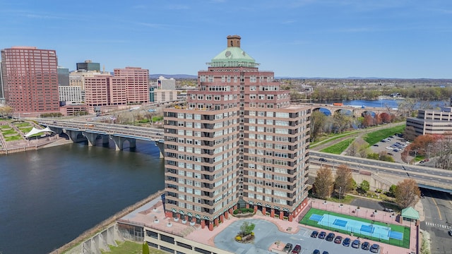 birds eye view of property with a view of city and a water view