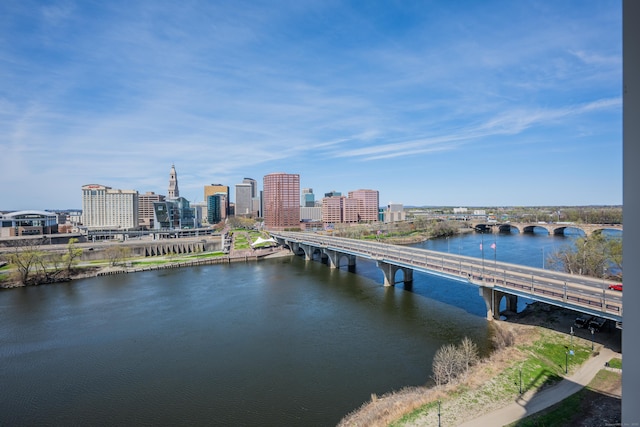 view of dock with a view of city and a water view