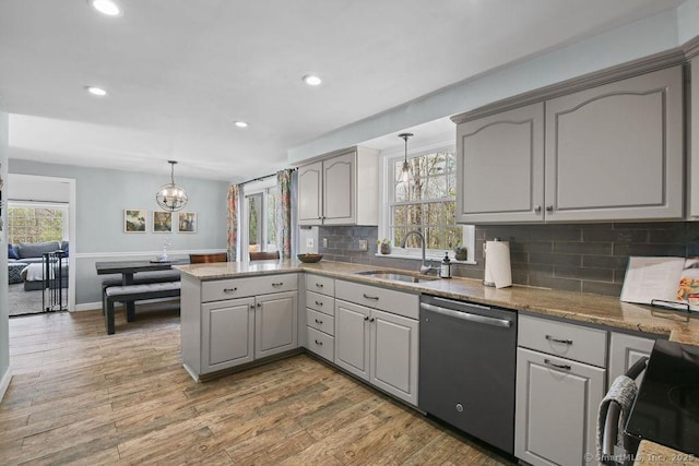 8 Gregory Ln, Simsbury, CT 06070 - kitchen with a sink, gray cabinetry, an inviting chandelier, dishwasher, and light wood finished floors
