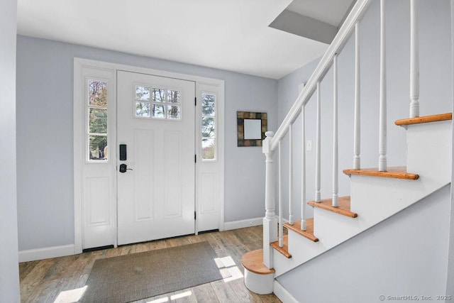 8 Gregory Ln, Simsbury, CT 06070 - foyer featuring stairway, wood finished floors, and baseboards