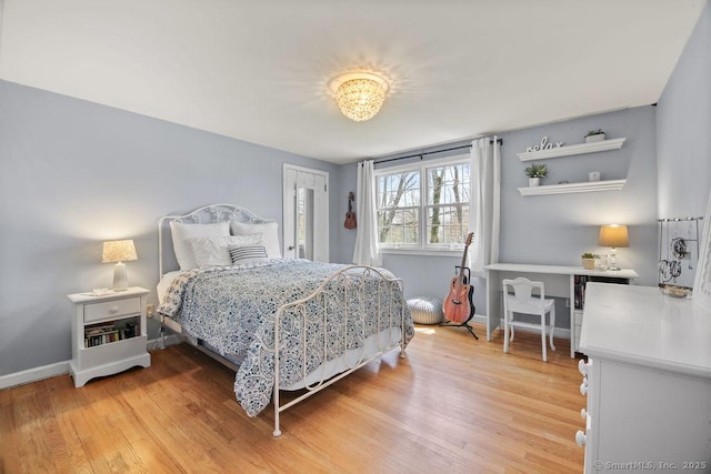 8 Gregory Ln, Simsbury, CT 06070 - bedroom featuring light wood-style floors and baseboards