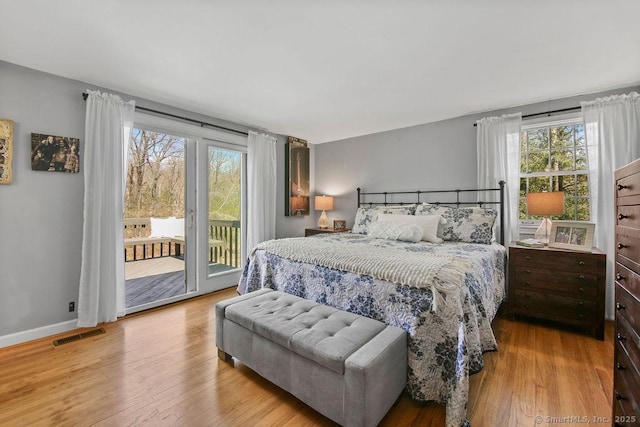 8 Gregory Ln, Simsbury, CT 06070 - bedroom with visible vents, wood finished floors, access to outside, and multiple windows
