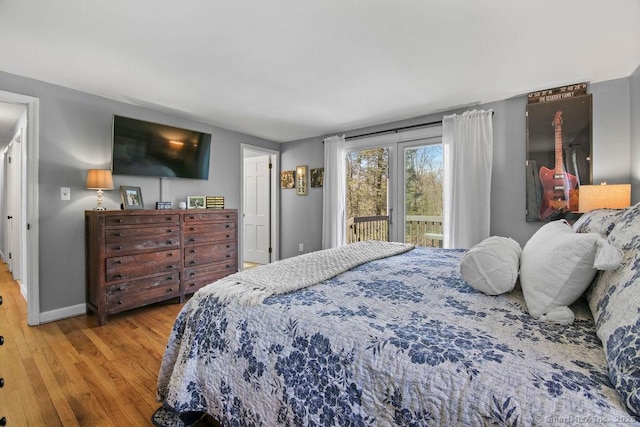 8 Gregory Ln, Simsbury, CT 06070 - bedroom featuring access to outside, wood finished floors, and baseboards