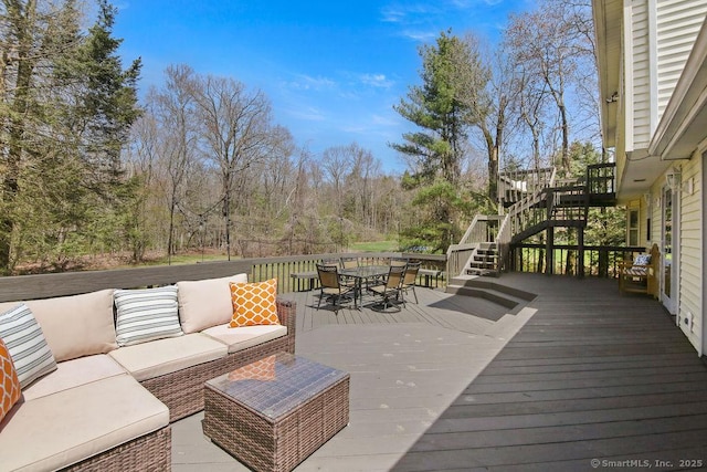 8 Gregory Ln, Simsbury, CT 06070 - wooden deck with outdoor lounge area, stairway, and outdoor dining area