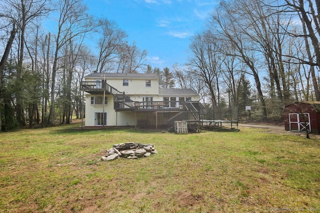 8 Gregory Ln, Simsbury, CT 06070 - view of yard with an outdoor structure, a fire pit, a wooden deck, a shed, and stairs