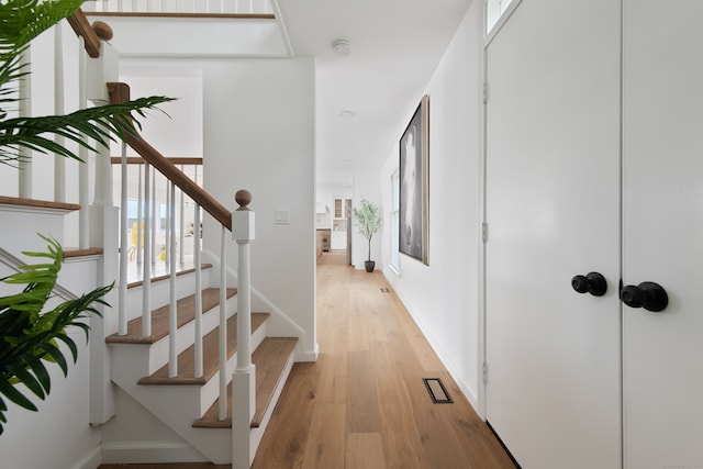 interior space featuring baseboards and wood finished floors