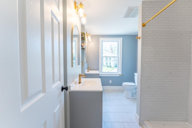 bathroom with visible vents, a stall shower, vanity, tile patterned floors, and toilet