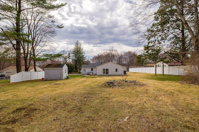 view of yard with a storage shed and an outdoor structure