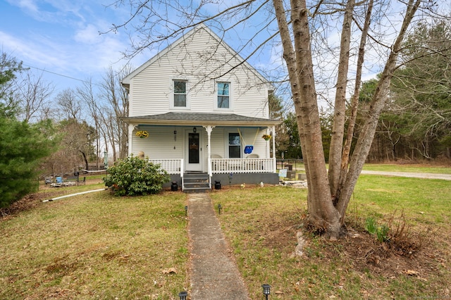 view of front of property with a front lawn and covered porch
