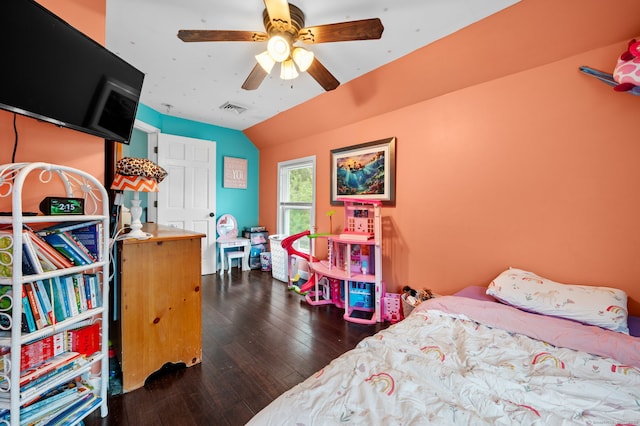 bedroom with lofted ceiling, hardwood / wood-style flooring, visible vents, and ceiling fan