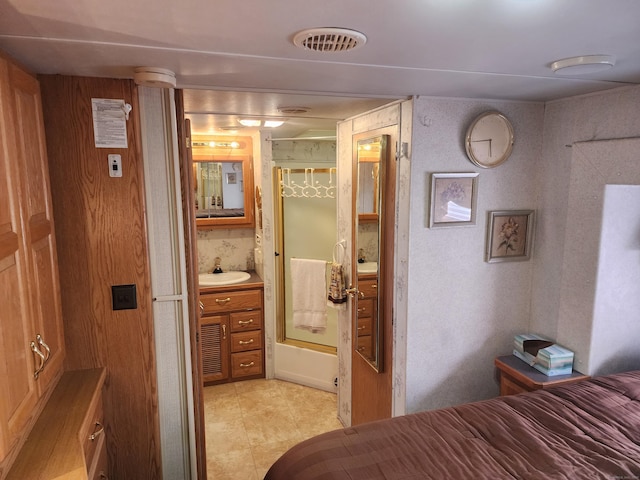 bedroom featuring visible vents and a sink