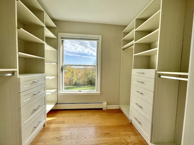 205 Arch Bridge Rd, Bethlehem, CT 06751 - walk in closet featuring baseboard heating and light wood-style floors