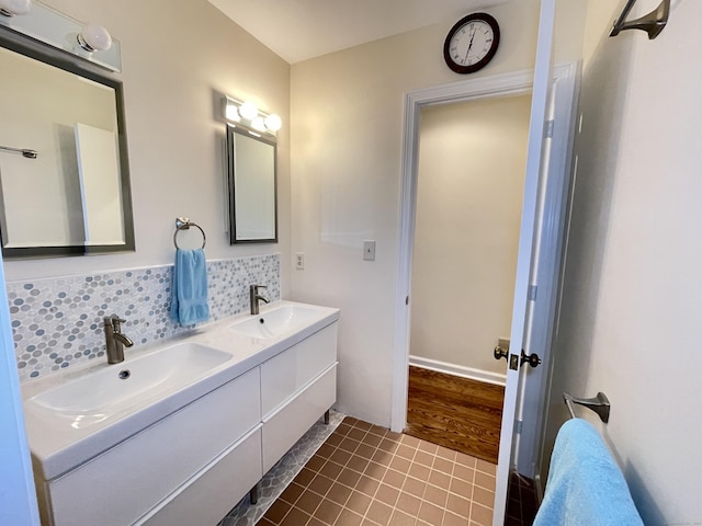 205 Arch Bridge Rd, Bethlehem, CT 06751 - bathroom featuring double vanity, tasteful backsplash, and tile patterned flooring