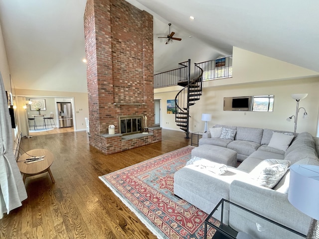 205 Arch Bridge Rd, Bethlehem, CT 06751 - living room with high vaulted ceiling, stairs, wood finished floors, ceiling fan, and a fireplace