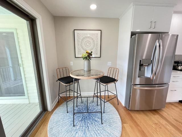 205 Arch Bridge Rd, Bethlehem, CT 06751 - dining area with light wood-style floors and recessed lighting
