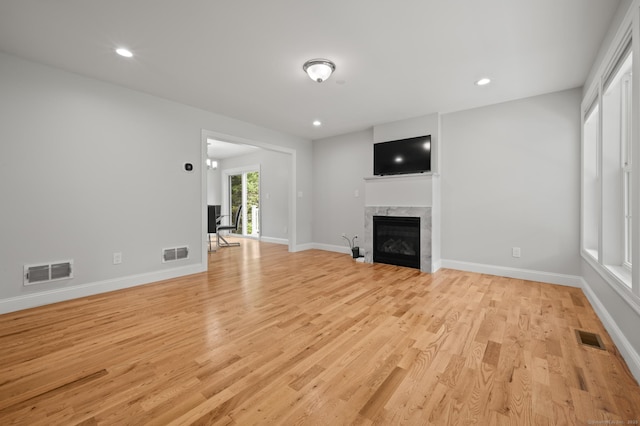 54 Edgerton Rd, Granby, CT 06090 - unfurnished living room with a fireplace, light wood-type flooring, and recessed lighting