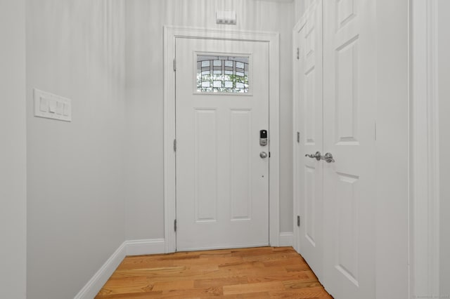 54 Edgerton Rd, Granby, CT 06090 - doorway to outside with light wood finished floors and baseboards