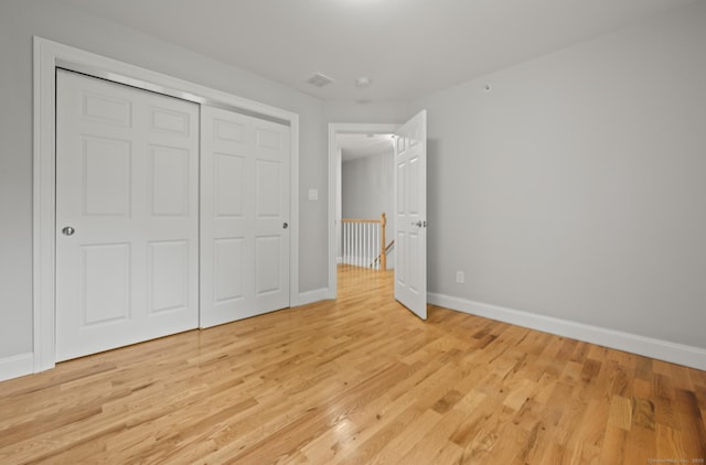54 Edgerton Rd, Granby, CT 06090 - unfurnished bedroom featuring light wood-type flooring and a closet