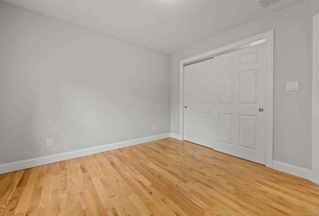 54 Edgerton Rd, Granby, CT 06090 - unfurnished bedroom with light wood finished floors and a closet