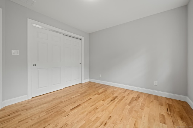 54 Edgerton Rd, Granby, CT 06090 - unfurnished bedroom featuring light wood-style floors and a closet